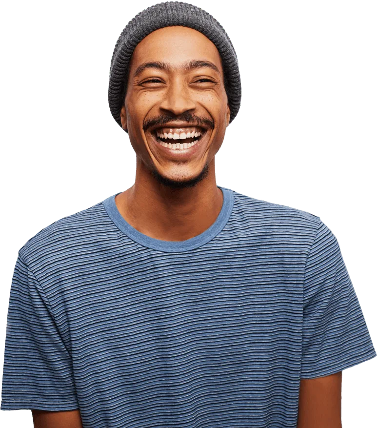 Smiling man wearing beanie and striped shirt portrait